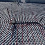 Landscape view of completed radiant heating system with multiple sections and agricultural site context