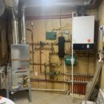 AIRMAX water heater system with expansion tank, manifold and brass fittings installation