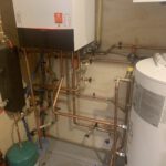Water heater and boiler assembly with expansion tank and control gauges