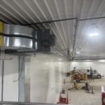Finished commercial shed interior with equipment and vehicle storage