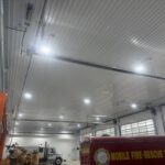 Overhead view of corrugated metal ceiling and commercial HVAC system