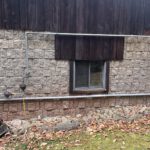Gas line running along house exterior wall