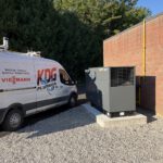 KDG van beside standby generator on concrete pad
