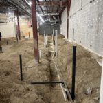 Interior framing and piping installation during renovation