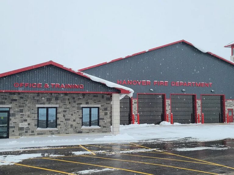 Front facade with Hanover Fire Department signage and office wing in winter
