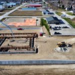 Aerial view of construction site foundation and building layout