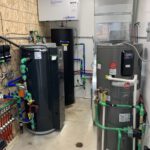 Mechanical room with water heaters, expansion tank, and manifold system