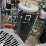 AltSource heat pump with gauges, expansion tank, and manifold assembly
