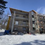 Vertical building exterior angle showing construction progress