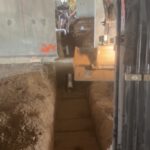 Interior worker installing radiant heating system under floor