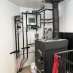 Radiant heating manifold assembly with multiple zone controls and colored PEX tubing