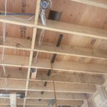 Wall cavity with foam insulation and white electrical conduit preparation