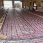 Radiant floor heating PEX tubing and insulation installed during construction