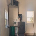 Outdoor wood boiler unit with unit heater and expansion tank