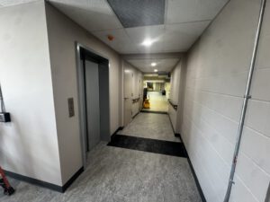 Interior hallway with clean drywall and painted surfaces