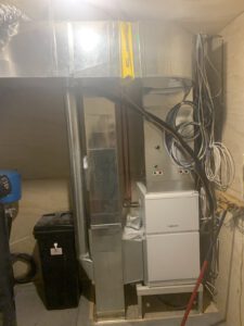 Large overhead in-floor radiant heating system with flexible tubing and controls