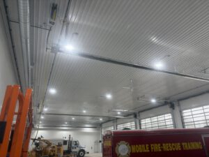 Overhead view of corrugated metal ceiling and commercial HVAC system