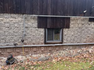Gas line running along house exterior wall