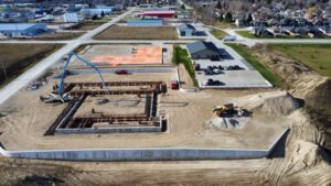 Aerial view of construction site foundation and building layout