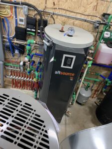 AltSource heat pump with gauges, expansion tank, and manifold assembly