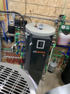 Heat pump manifold with color-coded piping and system instrumentation