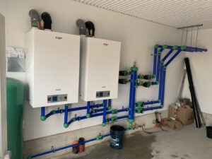 Twin high-efficiency boilers with color-coded manifold
