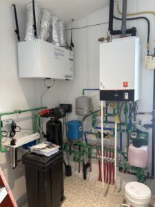 Laundry area with ERV ventilation system and flexible ductwork