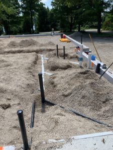 Site construction with excavation, equipment, and supply staging