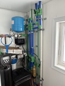 Finished radiant heating system with PEX tubing, tank and smart zone controls