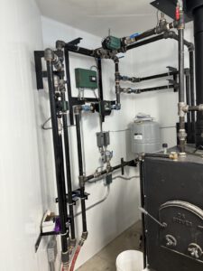 Radiant heating manifold system with pump and multiple control components