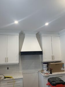 White finished cabinetry installation in bathroom space