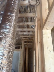 Close-up detail of radiant heating loop connections and manifold
