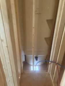 Joists and beams with radiant heating lines routed overhead