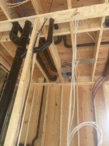 Framing studs and bays with integrated radiant heating installation