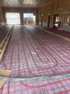 Radiant floor heating PEX tubing and insulation installed during construction