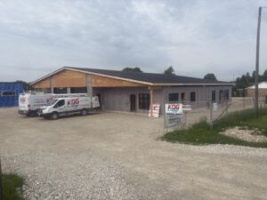 Construction phase showing building frame with KDG Plumbing work underway