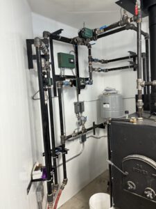 DS Stoves wood boiler with black steel piping